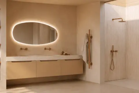 Moderne badkamer met verlichte spiegel, zwevend badmeubel, inloopdouche en koperen accenten. De spiegel verven zou deze serene sfeer nog versterken.